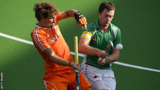 Constantijn Jonker battles with Ireland captain John Jackson in Belgium