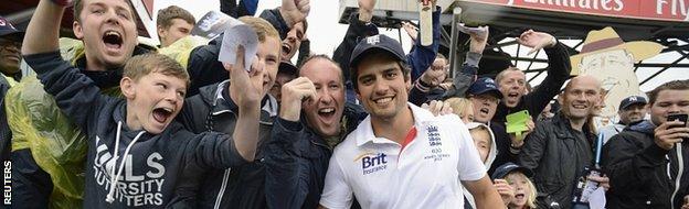 England captain Alastair Cook poses with fans