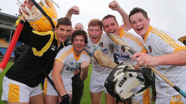 Antrim players celebrate after the final whistle at Semple Stadium, Thurles