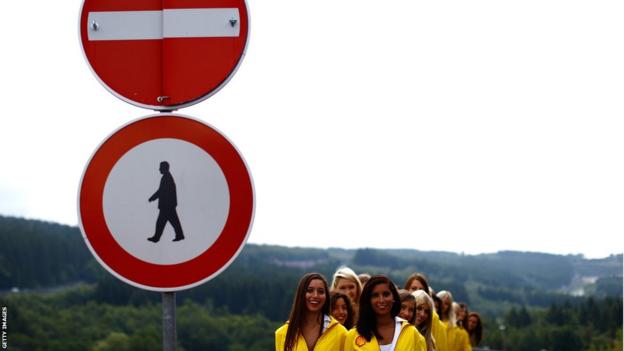 Grid girls are seen lining up before the Belgian Grand Prix at Circuit de Spa-Francorchamps