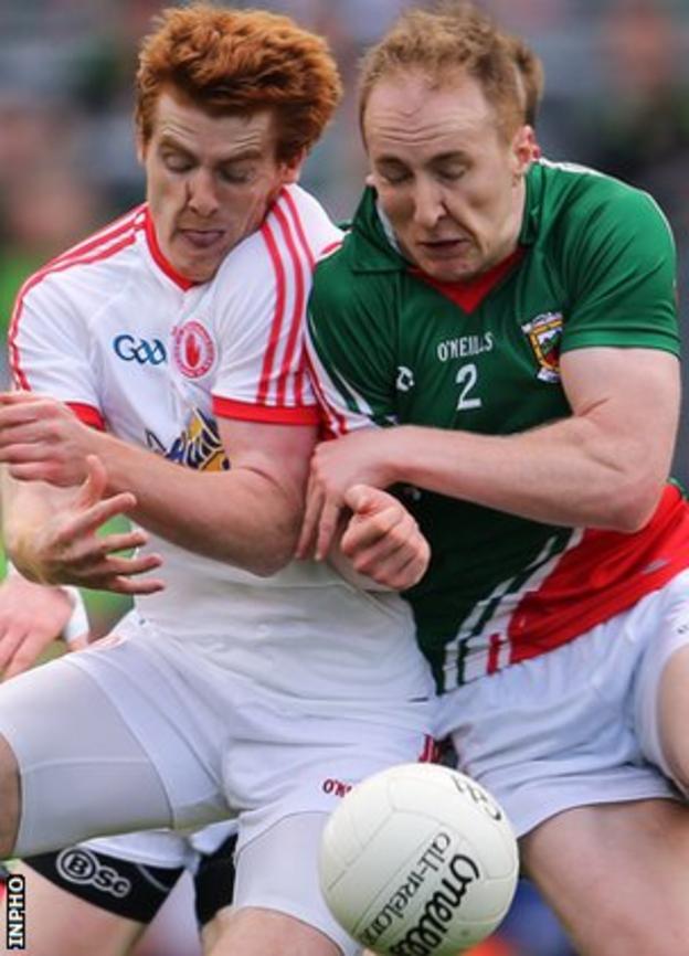 Peter Harte of Tyrone collides with Mayo's Tom Cunniffe