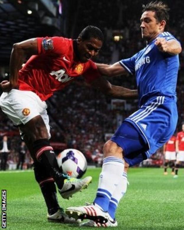 Manchester United winger Antonio Valencia is tackled by Frank Lampard