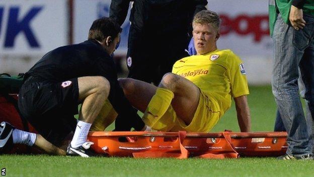 The stretcher comes out for Andreas Cornelius of Cardiff City