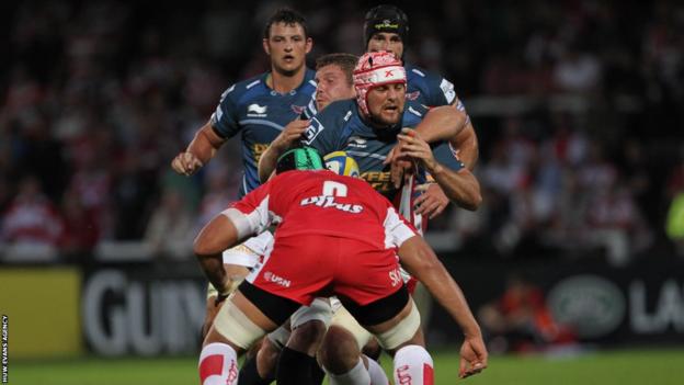 Jo Snyman is stopped by Gloucester's Ben Morgan as the Scarlets lose 31-17 in their pre-season game at Kingsholm