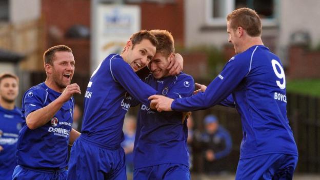 Stefan Lavery is congratulated by team-mates after opening the scoring for Dungannon against Glenavon