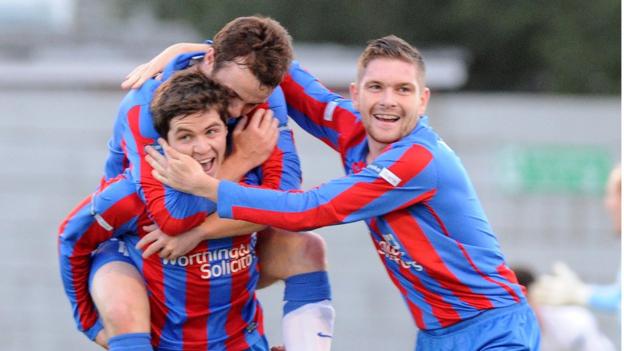 Ben Roy is congratulated after scoring the first of Ards' two goals in their win over Ballymena United