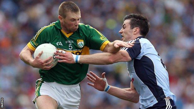 Dublin's Michael Darragh McAuley attempts to hold up Kerry's Tomas O Se
