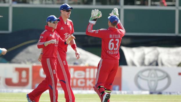 Eoin Morgan is congratulated by Boyd Rankin and Jos Butler after catching out Kevin O'Brien off the bowling of Ravi Bopara
