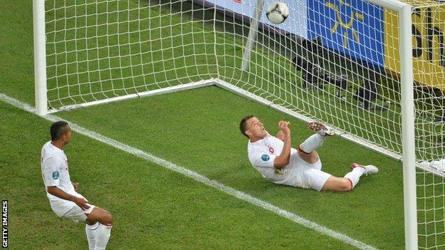 John Terry clears a shot from Ukraine's Marko Devic from under his crossbar during England's 1-0 win at Euro 2012