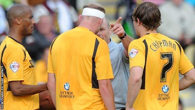 Referee Dave Phillips sends off Lee Minshull of Newport County