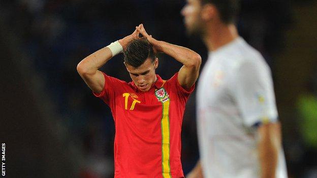 The world's most expensive player Gareth Bale looks despondent as Wales are beaten by Serbia in Cardiff