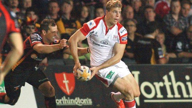 Dragons player Dan Evans closes in on Andrew Trimble in the Pro12 opener