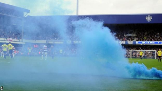 Play was briefly stopped because of a flare at Loftus Road