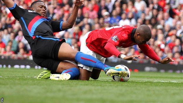 Manchester United's Ashley Young (right) is tackled by Kagisho Dikgacoi in the incident which saw the Crystal Palace man sent off