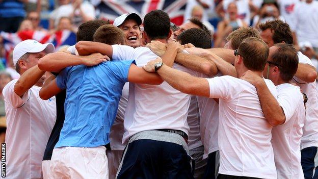 Andy Murray is mobbed by the Great Britain team
