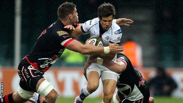 Adam D"Arcy of Bristol is tackled by Darren Barry of the Cornish Pirates