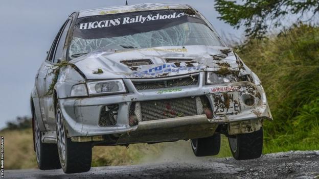Manx pair, Andrew Leece & Graham Fargher continuing to race in their Mitsubishi Evo VI despite suffering considerable damage in a crash earlier on stage 14