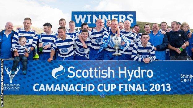 Newtonmore celebrate winning the 2013 Camanachd Cup final