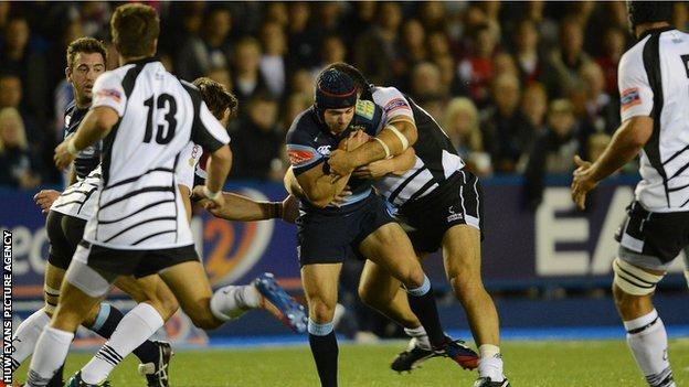 Cardiff Blues full-back Leigh Halfpenny is stopped by the Zebre defence