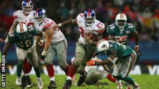Brandon Jacobs of New York Giants carries the ball during their 2007 match against Miami Dolphins at Wembley
