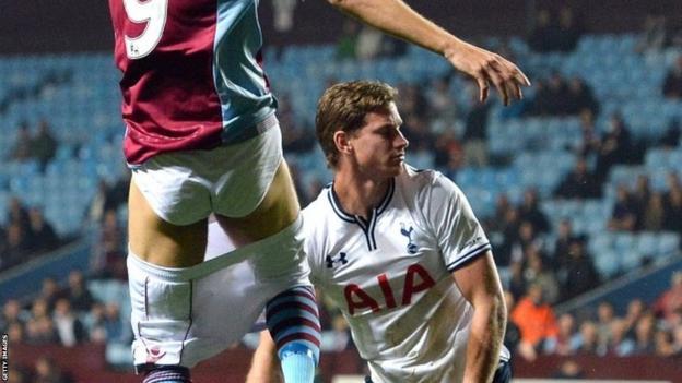 Aston Villa's Danish forward Nicklas Helenius loses his shorts during a challenge from Tottenham Hotspur's Belgian defender Jan Vertonghen