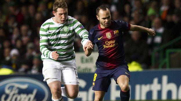 Andres Iniesta in action for Barcelona with Kris Commons