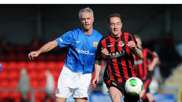 William Murphy and Timmy Adamson challenge for the ball as Crusaders beat Glenavon