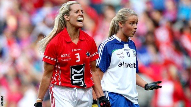 Brid Stack shows her delight after setting up Cork's goal alongside Monaghan's Caoimhe Mohan