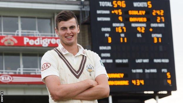 Surrey's Dominic Sibley in front of The Oval scoreboard