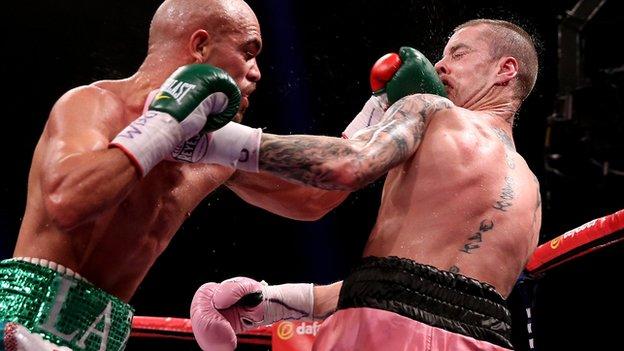 Ricky Burns is caught by a punch from Raymundo Beltran