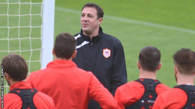 Cardiff City manager Malky Mackay talks to his players during a training session