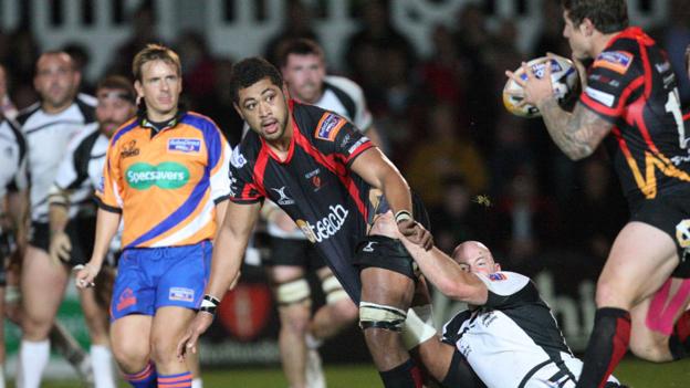 NG Dragons number eight Toby Faletau slips a pass to Ross Wardle during his team's 30-7 win over Zebre in the Pro12.