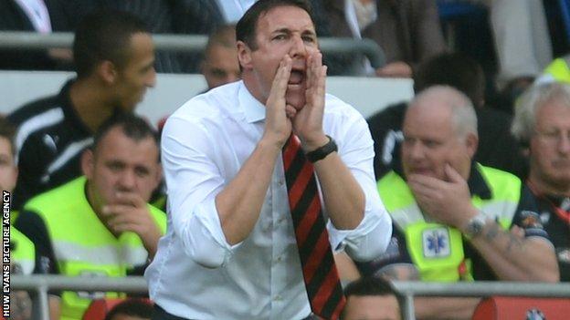 Malky Mackay on the touchlines