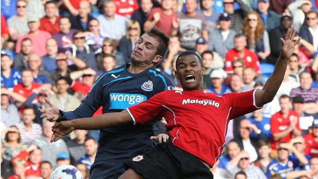 Newcastle's Davide Santon and Cardiff City's Fraizer Campbell clash during the Bluebirds' 2-1 home defeat in the Premier League