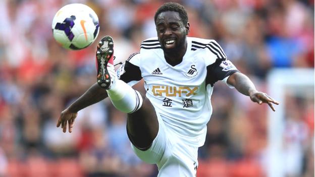 Nathan Dyer strains to control the high bouncing ball during Swansea's Premier League match at Southampton