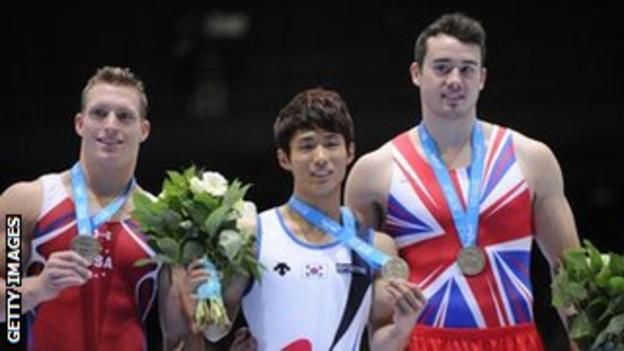 Kristian Thomas, right, is the first Briton to win a World Gymnastics medal on the vault