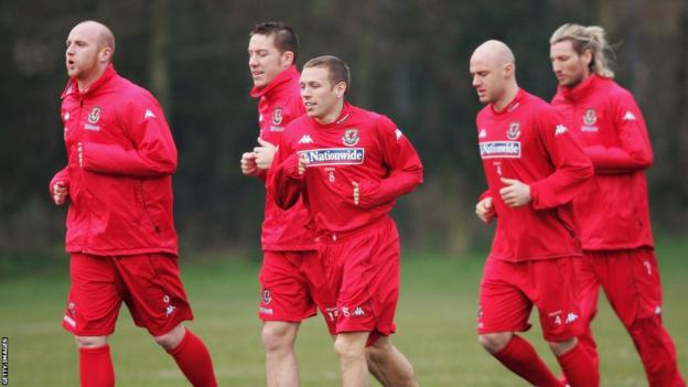 John Hartson, David Partridge, Robert Page and Robbie Savage take part in a Wales training session alongside Bellamy