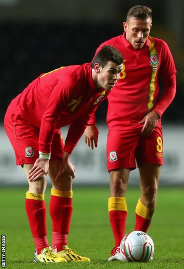 Gareth Bale and Bellamy line up a free-kick during the friendly international against Austria at Swansea's Liberty Stadium in February 2013
