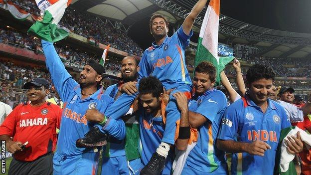 Sachin Tendulkar celebrates with the India team