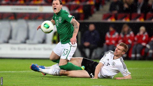 Anthony Stokes is tackled by Germany's Per Mertesacker