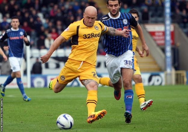 Newport County captain David Pipe has a shot on goal during his side’s League Two game at Rochdale.