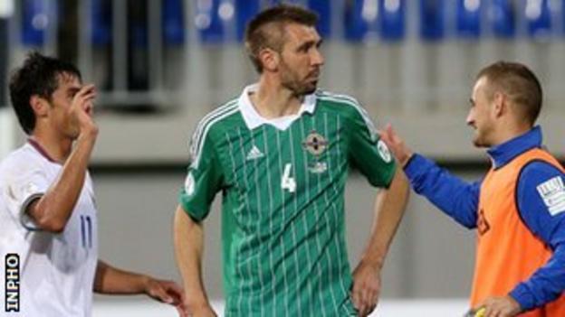 Gareth McAuley looks dejected after the 2-0 defeat by Azerbaijan