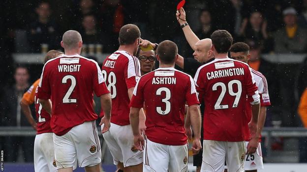 Barnet player manager Edgar Davids (fourth left) and Stephen Wright of Wrexham are both sent off by referee Nick Kinseley in their Conference Premier game