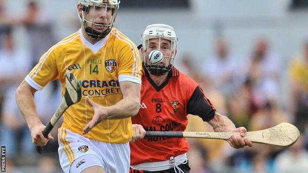 Neil McManus battles with Andy Savage in the 2010 Ulster Final