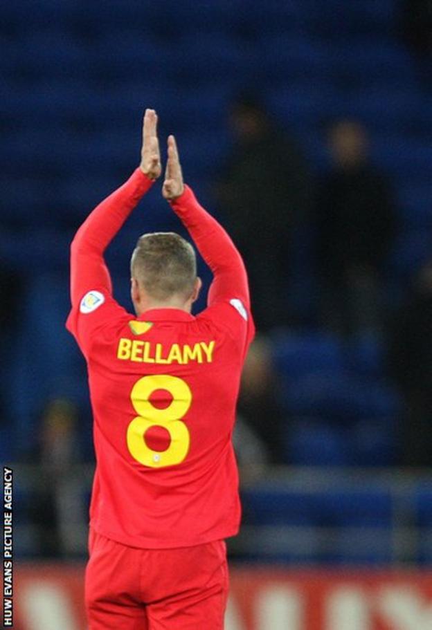 Bellamy acknowledges the Welsh supporters following his final home game, a 1-0 win over Macedonia at Cardiff City Stadium.
