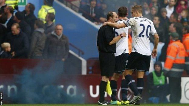 Linesman David Bryan who was hit by a flare during the Aston Villa v Tottenham Hotspur match.