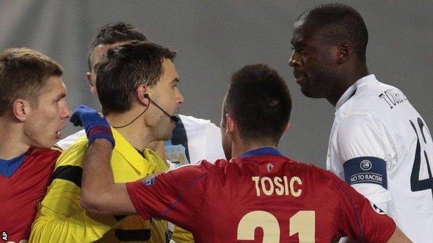 Manchester City"s Yaya Toure (r) speaks to the referee Ovidiu Hategan (l) during the Champions League match between CSKA Moscow and Manchester City