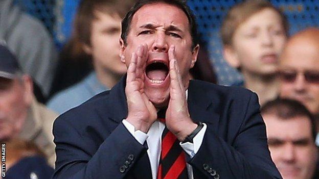 Malky Mackay shouts orders to his players from the touchline