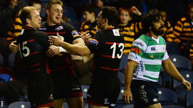 Edinburgh's Greig Tonks celebrates after his try against Treviso