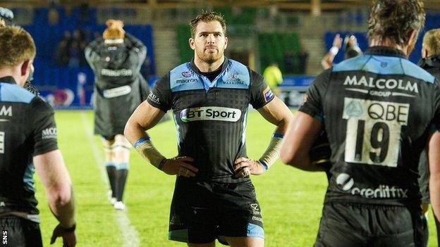Glasgow Warriors are dejected after their defeat at home to Munster